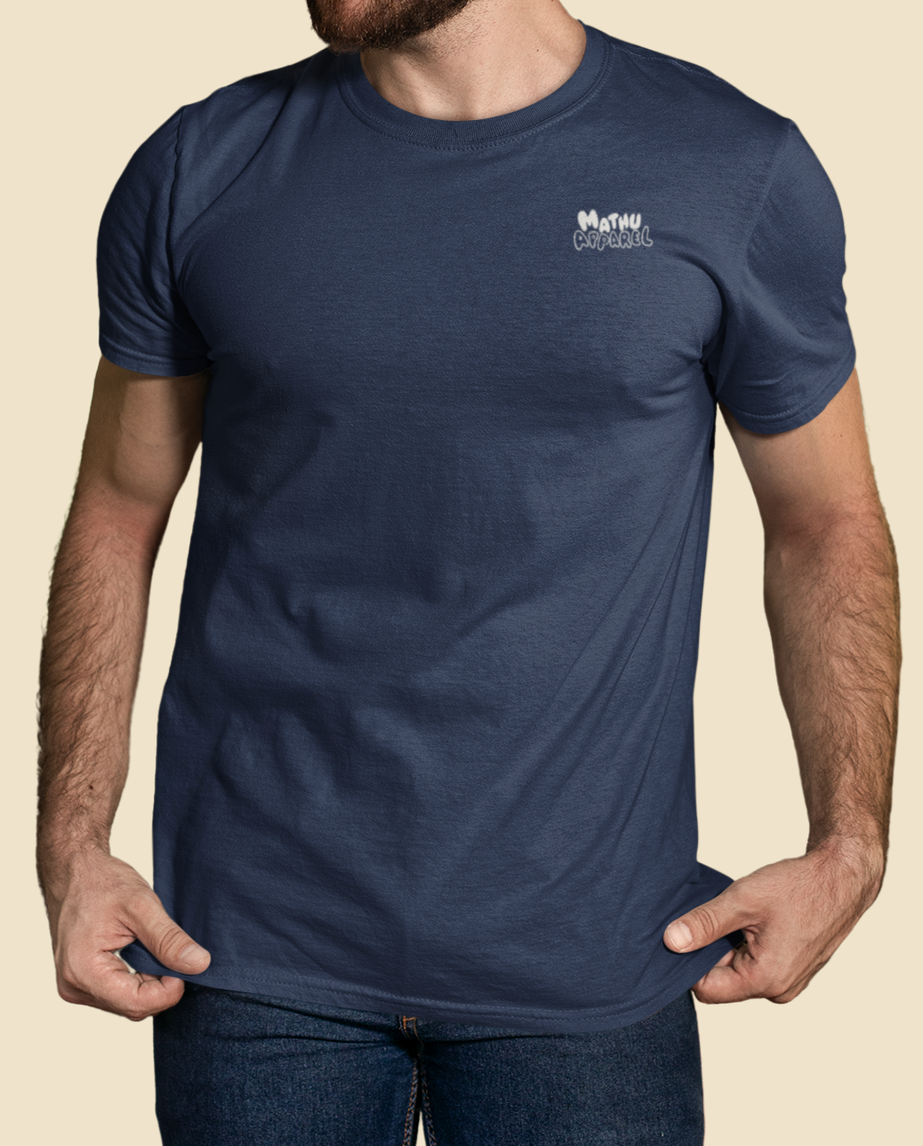 Man wearing a blue t-shirt with a logo on a beige background